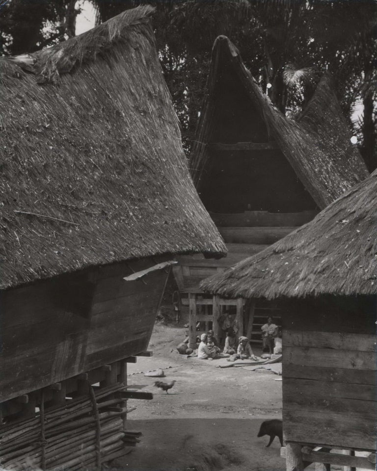 Item #CL172-86 The Typical “Saddle-Back” Dwellings In A Family Compound In Sumatra, Indonesia. E O. Hoppé, British.