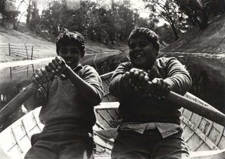 Item #CL178-21 Cousins Ralph And Jim Richardsen Boating On The Darling River. Mervyn Bishop,...