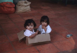 Item #CL185-174 Two Little Girls In Their Cardboard Box Crèche, Roluos Market, Near Siem...
