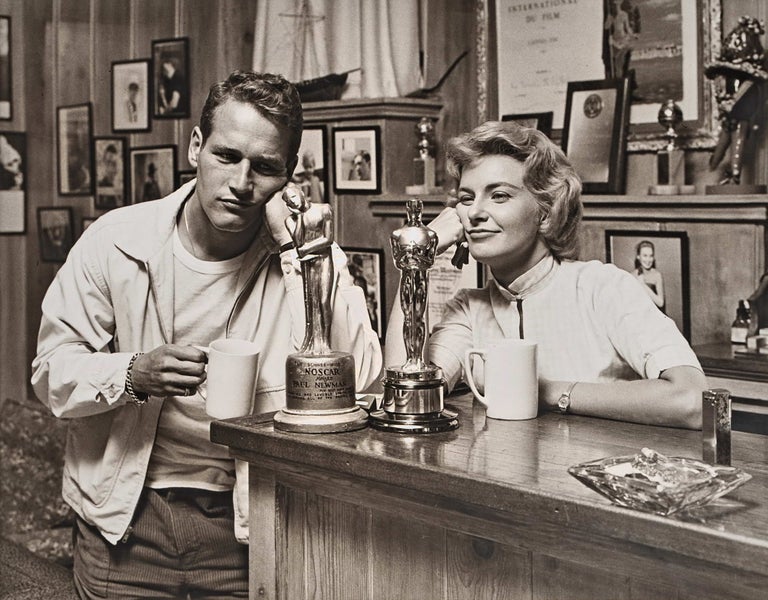 Item #CL185-44 Paul Newman And Joanne Woodward “Admiring” Their Awards. Sid Avery, Amer.