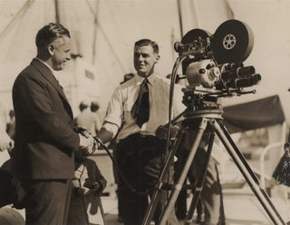 Item #CL187-125 [Cameraman Ray Vaughan Filming At A Movietone Event On Board SS...