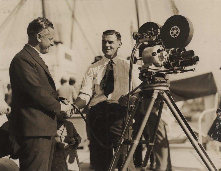 Item #CL187-125 [Cameraman Ray Vaughan Filming At A Movietone Event On Board SS “Sierra”, Circular Quay, Sydney]. active Aust., s, Broughton, Ward.